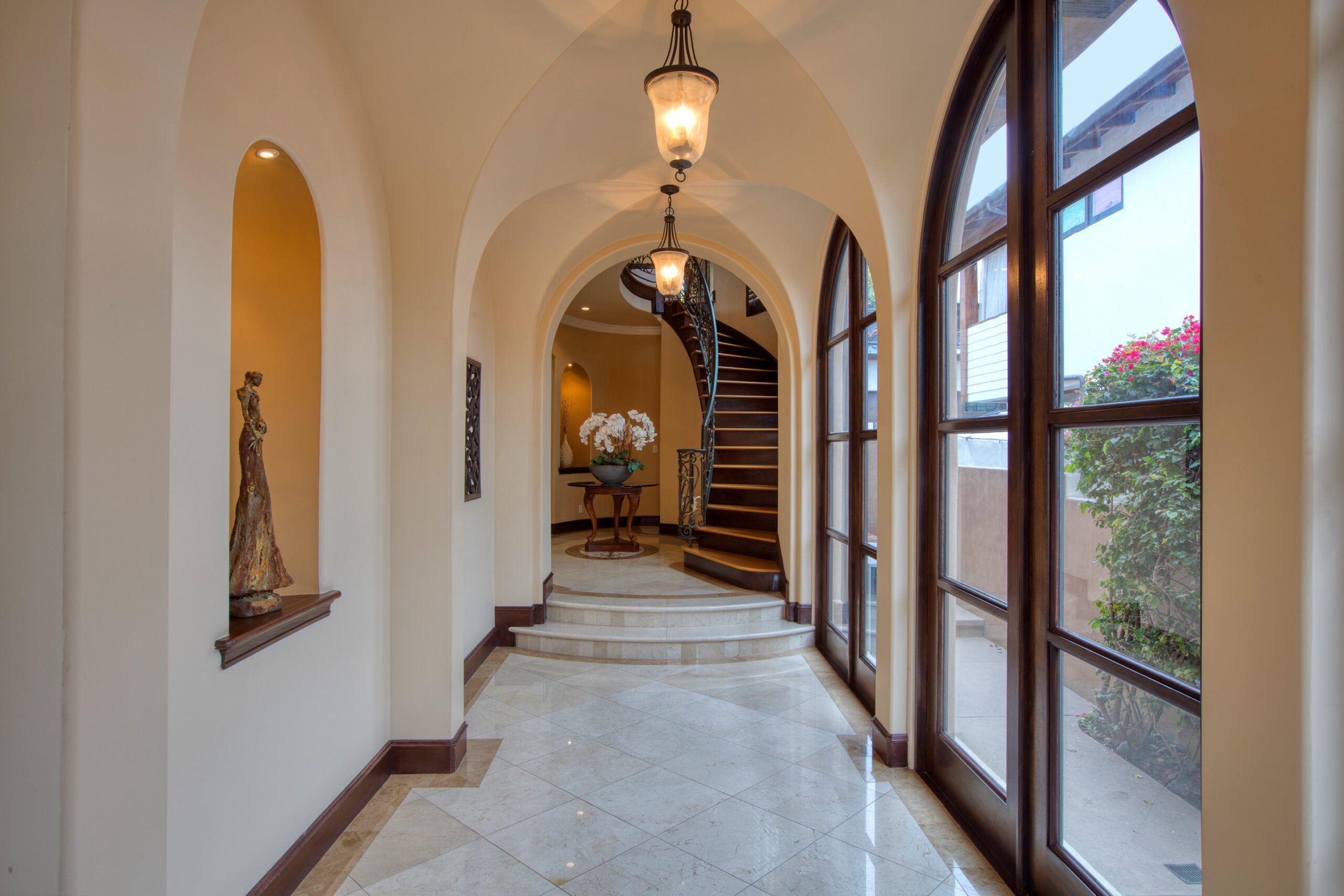 Arched hallway leading to the rotunda staircase